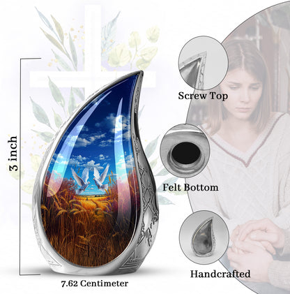 Calming Blue Dove Cremation Urn angled view of lid and engraved motif - smooth teardrop contour featuring dove art - mini keepsake memorial for portion of cremation ashes