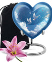 Heart-shaped, floral themed dove urn made of aluminium for funeral ashes