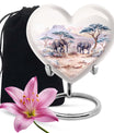 10-inch Heart-shaped Elephant Urn, featuring a butterfly theme, includes personal engraving and velvet pouch