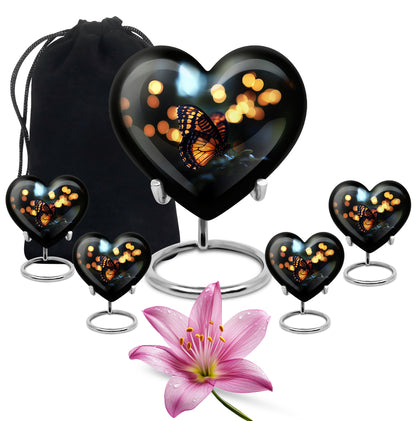 Charcoal Black Butterfly Cremation Urn close-up of engraving and surface detail - romantic heart urn with butterfly motif on aluminum - memorial set with one large and four small urns