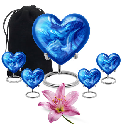 Indigo Blue Cremation Urn close-up of engraving and surface detail - heart-shaped blue design symbolizing eternal love - memorial set with one large and four small urns