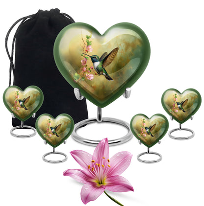Warm Gold Hummingbird Cremation Urn close-up of engraving and surface detail - romantic heart urn with hummingbird motif on aluminum - memorial set with one large and four small urns