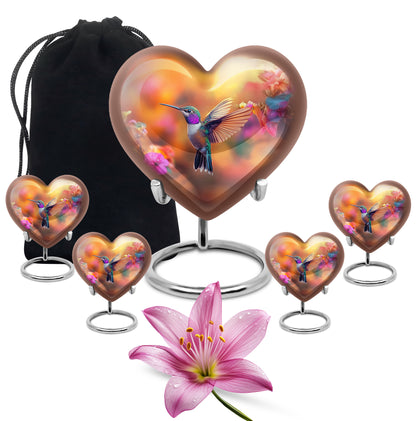 Royal Gold Hummingbird Cremation Urn close-up of engraving and surface detail - romantic heart urn with hummingbird motif on aluminum - memorial set with one large and four small urns