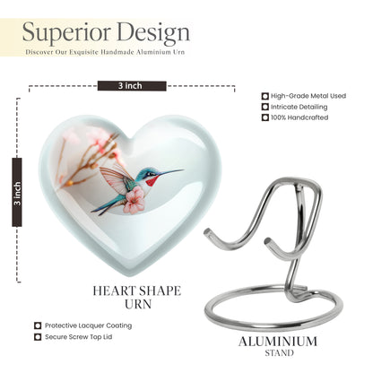 Platinum Silver Hummingbird Cremation Urn front view showing detailed design - heart-shaped hummingbird design symbolizing eternal love - mini keepsake memorial for portion of cremation ashes