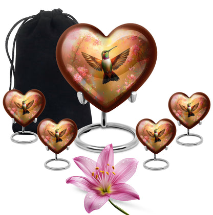 Amber Gold Hummingbird Cremation Urn close-up of engraving and surface detail - heart-shaped hummingbird design symbolizing eternal love - memorial set with one large and four small urns