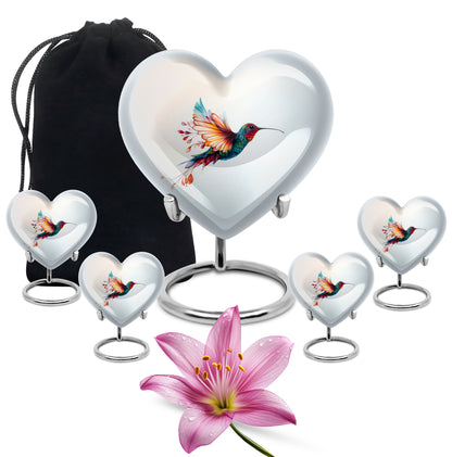 Gleaming Silver Hummingbird Cremation Urn close-up of engraving and surface detail - loving heart memorial featuring hummingbird pattern - memorial set with one large and four small urns