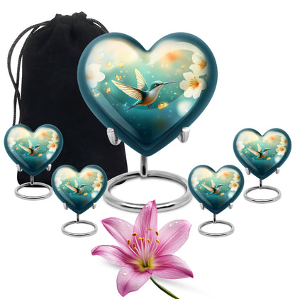 Mystic Teal Hummingbird Cremation Urn close-up of engraving and surface detail - romantic heart urn with hummingbird motif on aluminum - memorial set with one large and four small urns