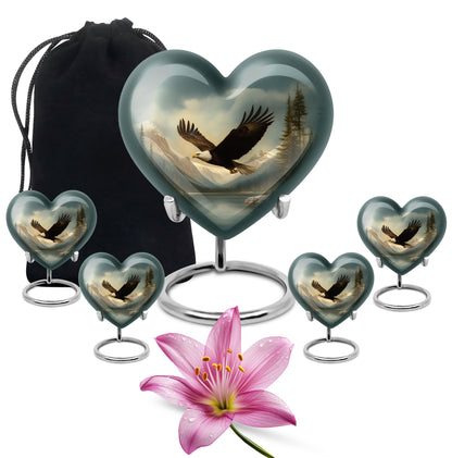 Deep Black Eagle Cremation Urn close-up of engraving and surface detail - heart-shaped eagle design symbolizing eternal love - memorial set with one large and four small urns