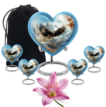 Powder Blue Eagle Cremation Urn close-up of engraving and surface detail - heart-shaped eagle design symbolizing eternal love - memorial set with one large and four small urns
