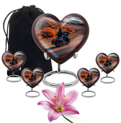 Gilded Gold Bike Cremation Urn close-up of engraving and surface detail - heart-shaped bike design symbolizing eternal love - memorial set with one large and four small urns