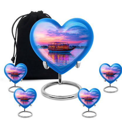 Serene Blue Boat Cremation Urn close-up of engraving and surface detail - romantic heart urn with boat motif on aluminum - memorial set with one large and four small urns