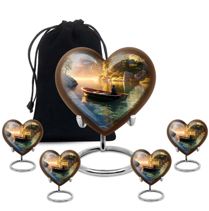 Antique Gold Boat Cremation Urn close-up of engraving and surface detail - heart-shaped boat design symbolizing eternal love - memorial set with one large and four small urns