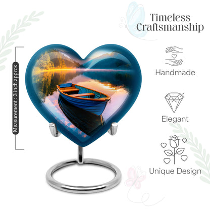 Deep Teal Boat Cremation Urn front view showing detailed design - romantic heart urn with boat motif on aluminum - mini keepsake memorial for portion of cremation ashes
