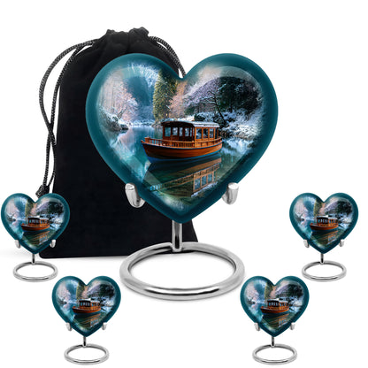 Dusty Blue Boat Cremation Urn close-up of engraving and surface detail - heart-shaped boat design symbolizing eternal love - memorial set with one large and four small urns