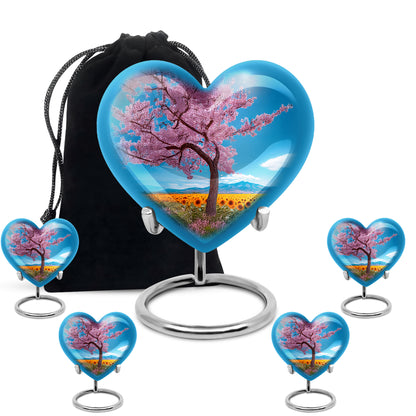 Soft Blue Cherry Blossom Cremation Urn close-up of engraving and surface detail - romantic heart urn with cherry blossom motif on aluminum - memorial set with one large and four small urns