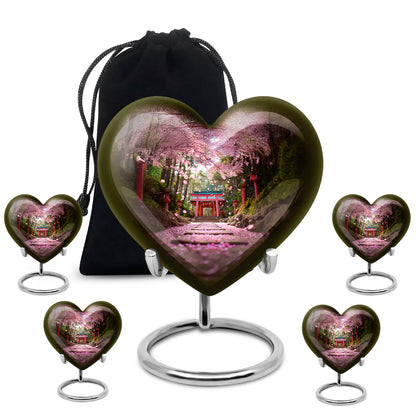 Royal Gold Cherry Blossom Cremation Urn close-up of engraving and surface detail - romantic heart urn with cherry blossom motif on aluminum - memorial set with one large and four small urns
