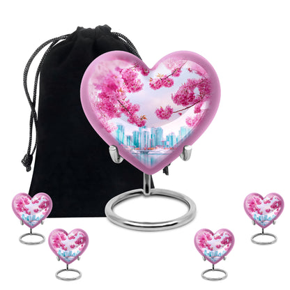 Vintage Pink Cherry Blossom Cremation Urn close-up of engraving and surface detail - romantic heart urn with cherry blossom motif on aluminum - memorial set with one large and four small urns
