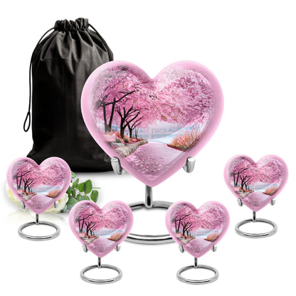 Soft Pink Cherry Blossom Cremation Urn close-up of engraving and surface detail - romantic heart urn with cherry blossom motif on aluminum - memorial set with one large and four small urns