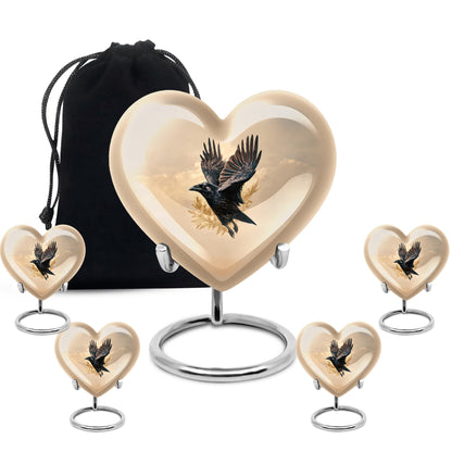 Amber Gold Crow Cremation Urn close-up of engraving and surface detail - heart-shaped crow design symbolizing eternal love - memorial set with one large and four small urns
