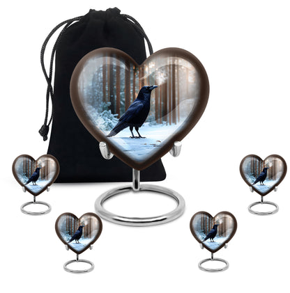 Powder Blue Crow Cremation Urn close-up of engraving and surface detail - heart-shaped crow design symbolizing eternal love - memorial set with one large and four small urns