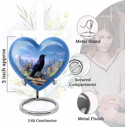 Bright Blue Crow Cremation Urn front view showing detailed design - romantic heart urn with crow motif on aluminum - mini keepsake memorial for portion of cremation ashes