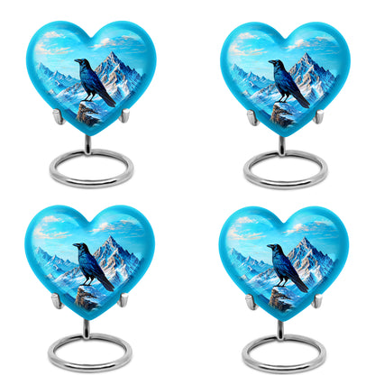 Sapphire Blue Crow Cremation Urn angled view of lid and engraved motif - compassionate heart-crow combination with gentle curves - 10 inch aluminum urn for cremated remains