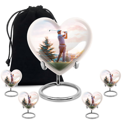 Polished Silver Golf Cremation Urn close-up of engraving and surface detail - compassionate heart-golf combination with gentle curves - memorial set with one large and four small urns