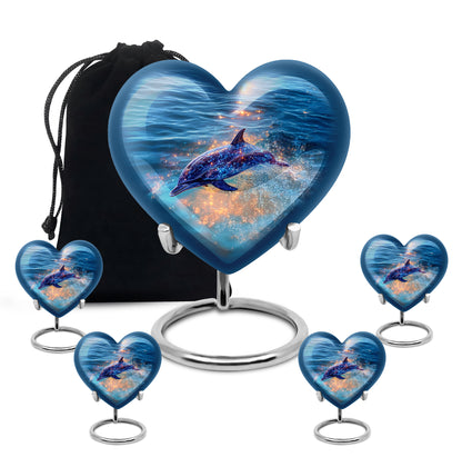 Navy Blue Dolphin Cremation Urn close-up of engraving and surface detail - heart-shaped dolphin design symbolizing eternal love - memorial set with one large and four small urns