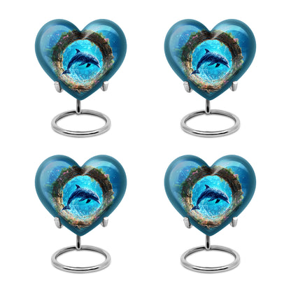Pastel Blue Dolphin Cremation Urn angled view of lid and engraved motif - heart-shaped dolphin design symbolizing eternal love - 10 inch aluminum urn for cremated remains