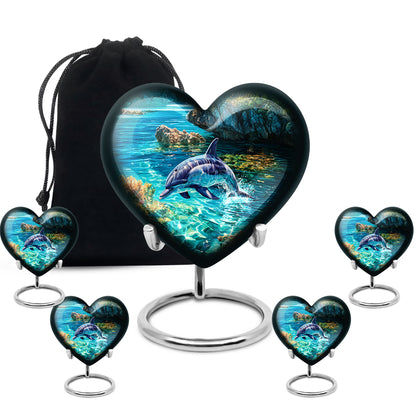 Verdant Green Dolphin Cremation Urn close-up of engraving and surface detail - loving heart memorial featuring dolphin pattern - memorial set with one large and four small urns