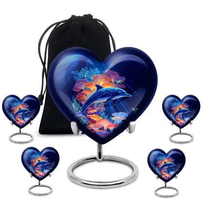 Pastel Blue Dolphin Cremation Urn close-up of engraving and surface detail - heart-shaped dolphin design symbolizing eternal love - memorial set with one large and four small urns