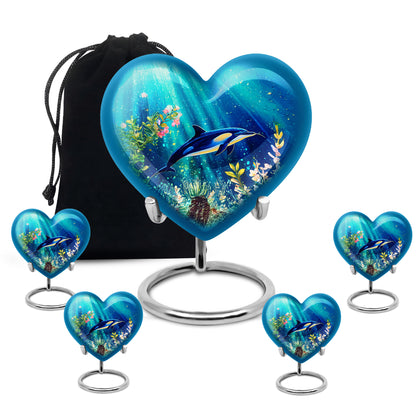 Soft Teal Dolphin Cremation Urn close-up of engraving and surface detail - heart-shaped dolphin design symbolizing eternal love - memorial set with one large and four small urns