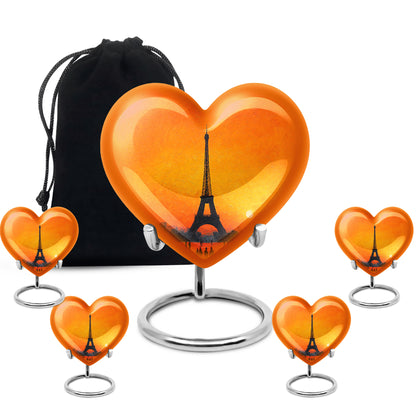 Burnished Gold Eiffel Tower Cremation Urn close-up of engraving and surface detail - romantic heart urn with eiffel tower motif on aluminum - memorial set with one large and four small urns