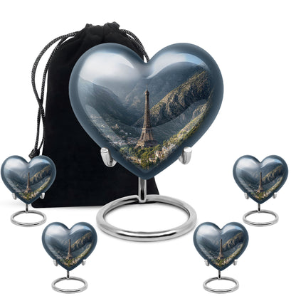 Bright Blue Eiffel Tower Cremation Urn close-up of engraving and surface detail - compassionate heart-eiffel tower combination with gentle curves - memorial set with one large and four small urns