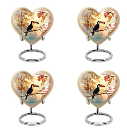 Sunrise Gold Hornbill Cremation Urn angled view of lid and engraved motif - heart-shaped hornbill design symbolizing eternal love - 10 inch aluminum urn for cremated remains