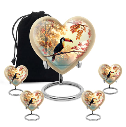 Gilded Gold Hornbill Cremation Urn close-up of engraving and surface detail - heart-shaped hornbill design symbolizing eternal love - memorial set with one large and four small urns