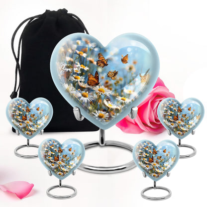 Sapphire Blue Daisy Cremation Urn close-up of engraving and surface detail - romantic heart urn with daisy motif on aluminum - memorial set with one large and four small urns