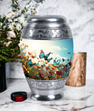 Large urn for human ashes with vibrant, lively butterflies design, designed as a loving tribute for a mother