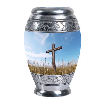 Christ Urn in blue sky for cremation Or Memorial Day