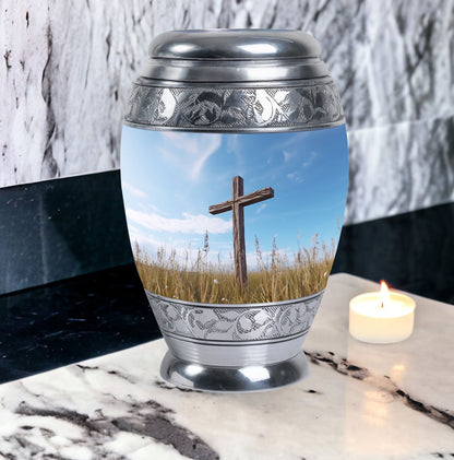 Christ Urn in blue sky for cremation Or Memorial Day