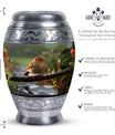 Classic sparrow cremation urn in aluminum.