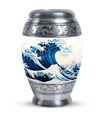 Large, white, decorative cremation urn for men with ocean waves design, suitable for adult ashes