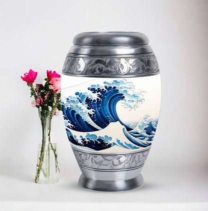 Large, white, decorative cremation urn for men with ocean waves design, suitable for adult ashes