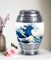 Large, white, decorative cremation urn for men with ocean waves design, suitable for adult ashes
