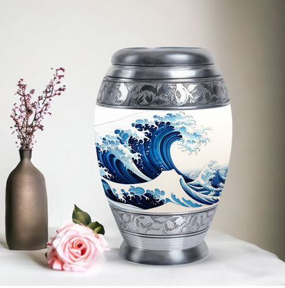 Large, white, decorative cremation urn for men with ocean waves design, suitable for adult ashes