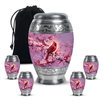 Coral Pink Cardinal Cremation Urn detail view - ornate monarch-style cardinal relief on brushed aluminum - memorial set with one large and four small urns
