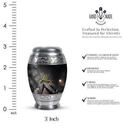 Ebony Dragonfly Cremation Urn lifestyle display on memorial shelf - ornate monarch-style dragonfly relief on brushed aluminum - mini keepsake memorial for portion of cremation ashes