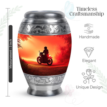 Fiery Red Bike Cremation Urn lifestyle display on memorial shelf - royal bike engraving with decorative scrollwork - mini keepsake memorial for portion of cremation ashes
