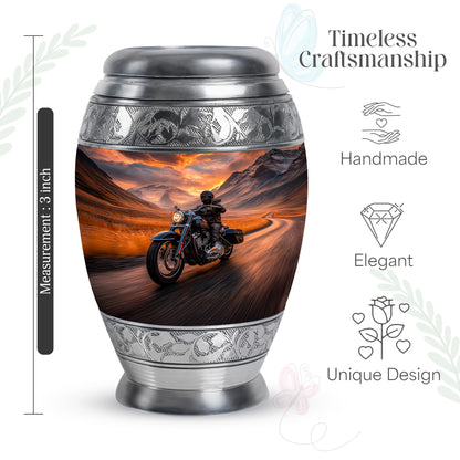Ruby Red Bike Cremation Urn lifestyle display on memorial shelf - majestic bike pattern with filigree border - mini keepsake memorial for portion of cremation ashes