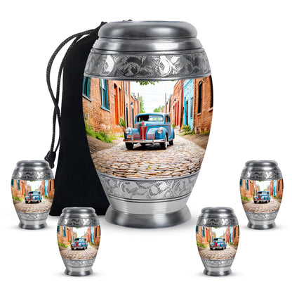 Frosted Silver Car Cremation Urn detail view - royal car engraving with decorative scrollwork - memorial set with one large and four small urns